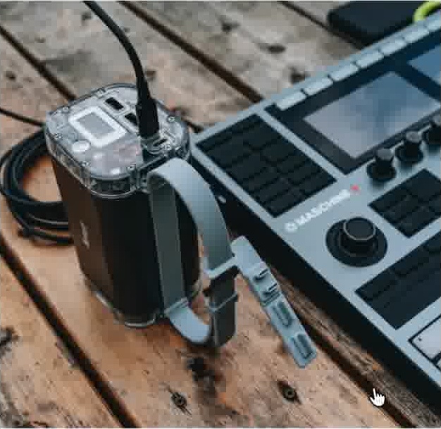 Electronic equipment and cables on a textured wooden workbench